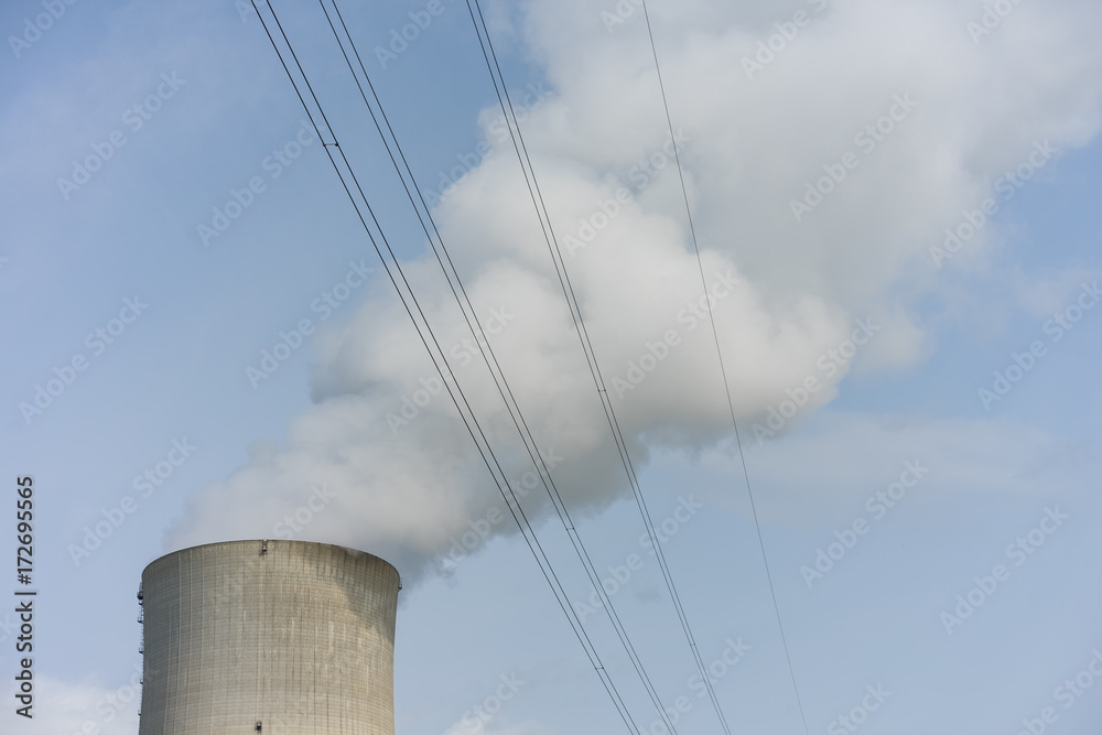 Cooling tower of nuclear power plant against the blue sky chimney landscape