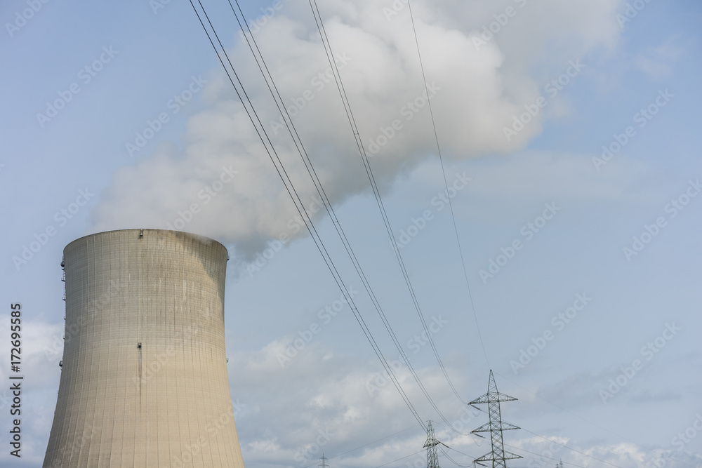 Cooling tower of nuclear power plant against the blue sky chimney landscape