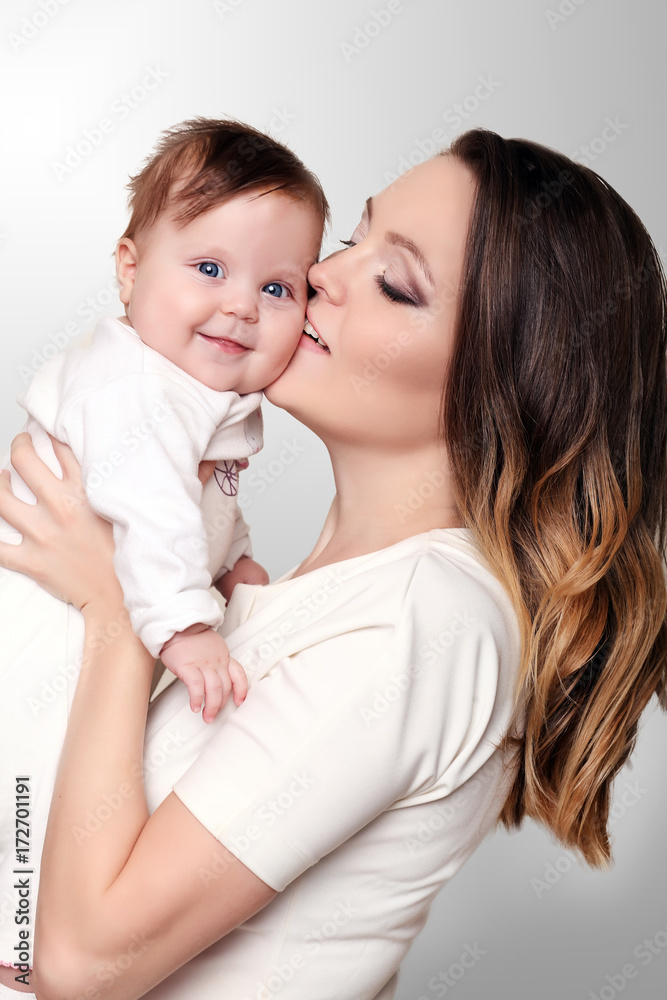 Mother and Baby kissing and hugging. Happy Family Mother and Baby kissing and hugging. Happy Family
