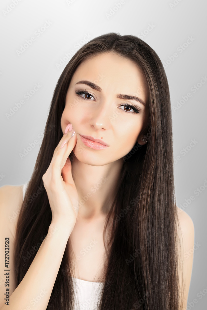 Beautiful young woman suffering from toothache, close up Beautiful young woman suffering from toothache, close up