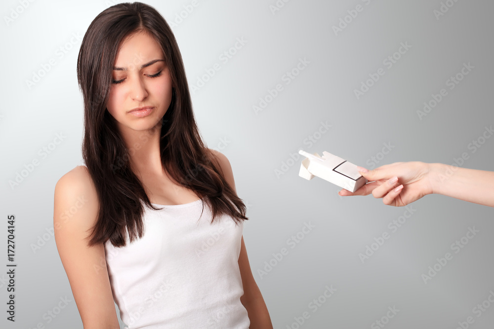 Healthy Young Woman Refusing To Take Cigarette From Pack. Portrait Of Beautiful Female Showing Stop Sign With Hand To Cigarettes. Quit Smoking Concept. High Resolution Healthy Young Woman Refusing To Take Cigarette From Pack. Portrait Of Beautiful Female Showing Stop Sign With Hand To Cigarettes. Quit Smoking Concept. High Resolution