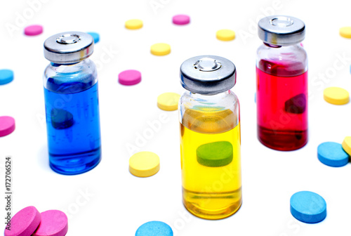 Multicolored tablets and vaccines against a white background