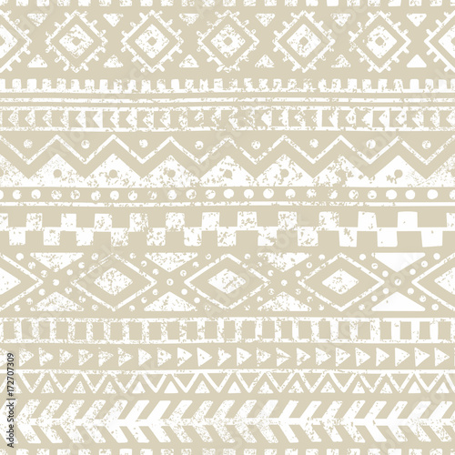 Seamless geometric pattern. Print for your textile. Ethnic and tribal motifs. Gray and white ornament. Grungy texture.