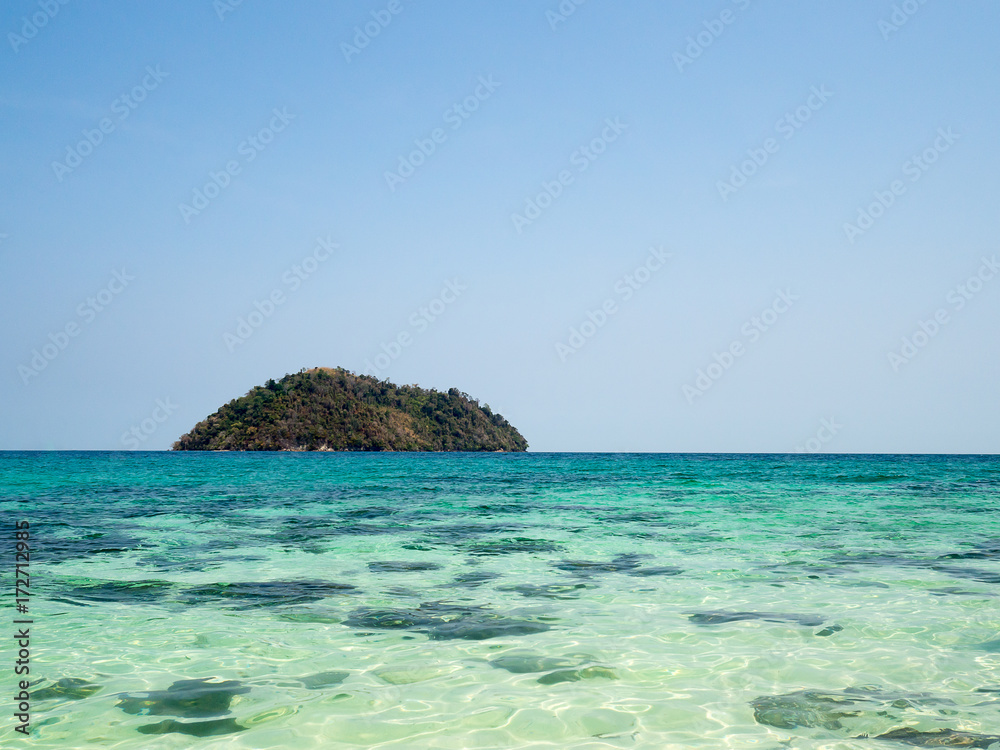 Crystal turquoise green sea ocean clear water and mountain at Lipe Island, Satun, Thailand.
