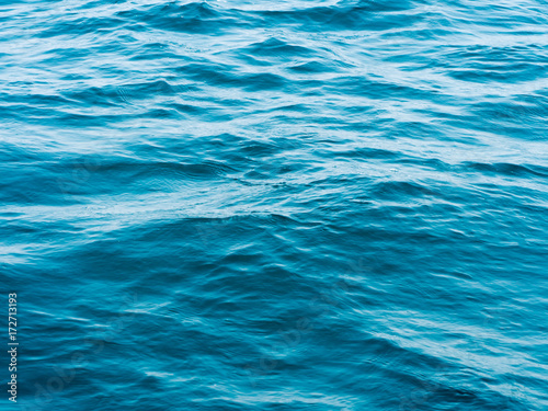 Texture blue ripples water in sea ocean for background. Surface of blue water in nature ocean. © ieang