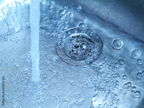 water running in kitchen sink from tap