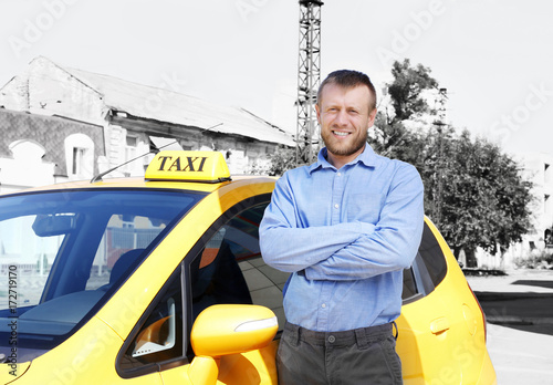 Handsome taxi driver near c...