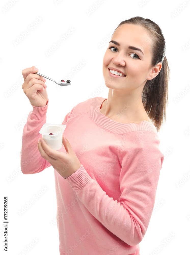 Young woman eating yogurt on white background Young woman eating yogurt on white background