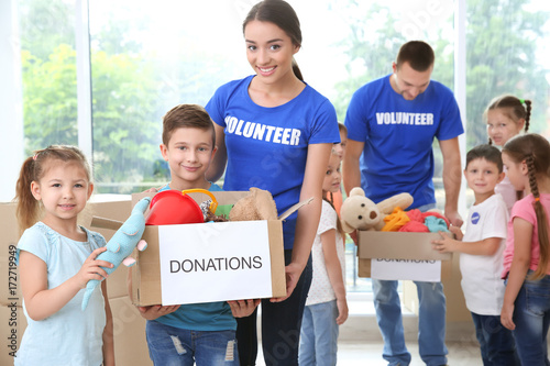 Happy volunteers with child...