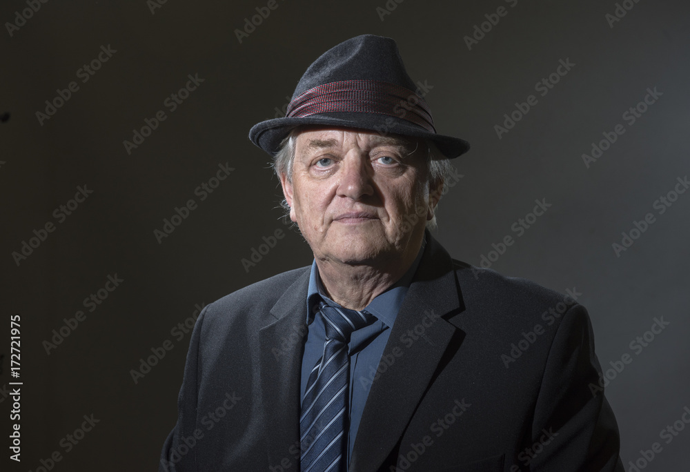 Portrait image of a mature man in a shirt tie and fedora hat Portrait image of a mature man in a shirt tie and fedora hat