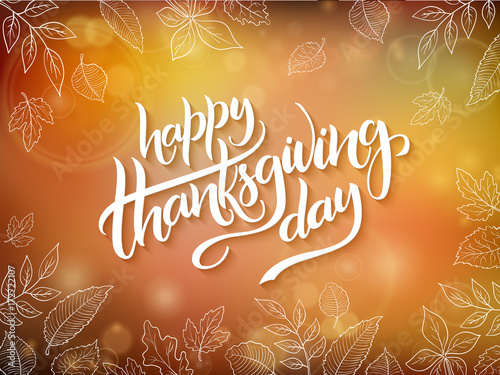 Vector thanksgiving greeting card with hand lettering label - happy thanksgiving day - and autumn doodle leaves on blurred background