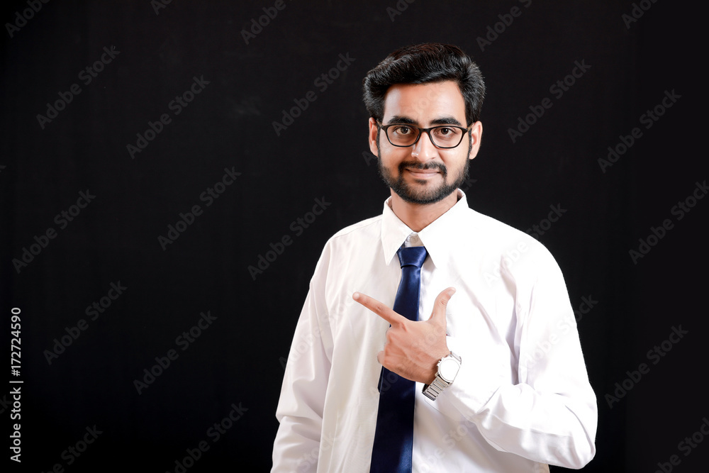 Indian young man showing direction with hand Indian young man showing direction with hand