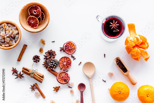 Celebrate new year winter evening with hot drink. Mulled wine or grog ingredients. White background top view.