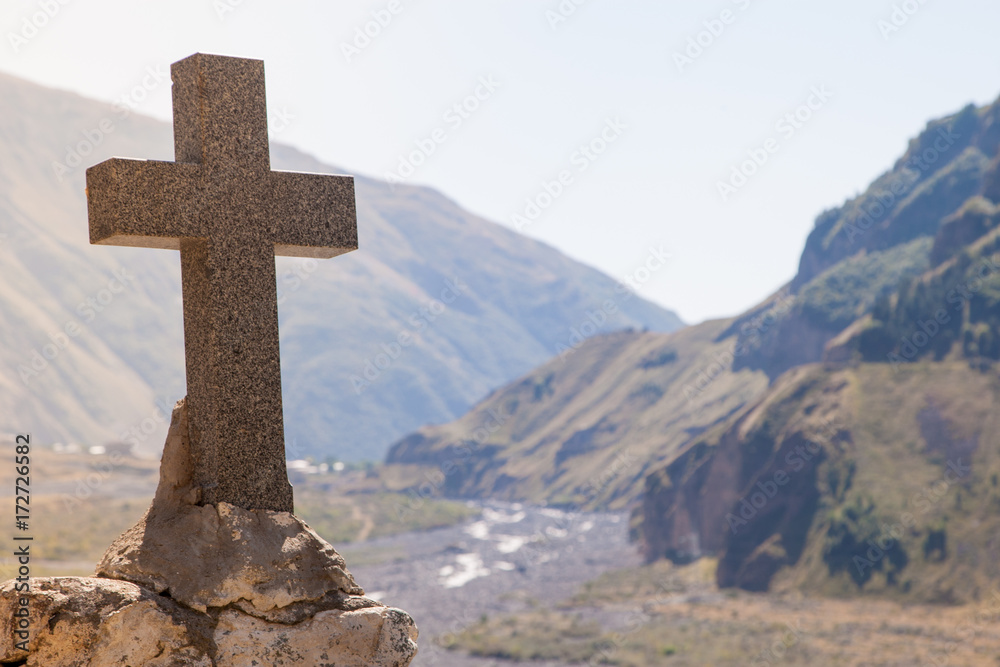Stone symbol cross of orthodox christianity in mountains of Georgia with copy space Stone symbol cross of orthodox christianity in mountains of Georgia with copy space
