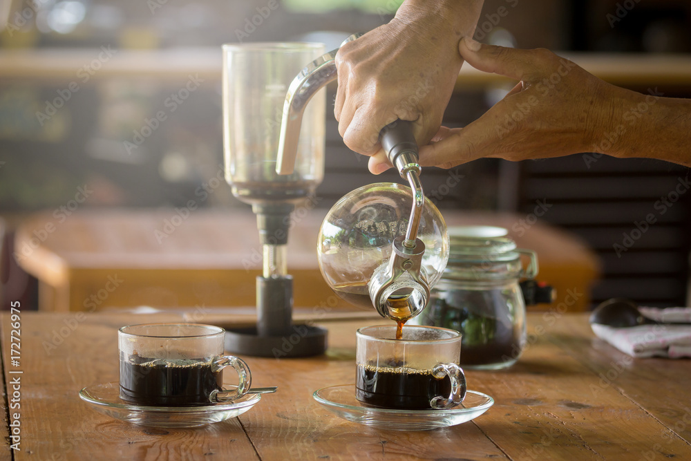 Ταπετσαρία close up of siphon vacuum, coffee cup and siphon vacuum coffee maker at shop