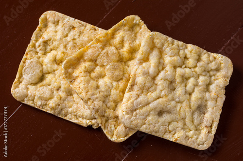 Corn bread slices on the brown wooden table background