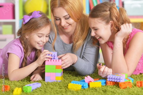  family playing with  blocks together