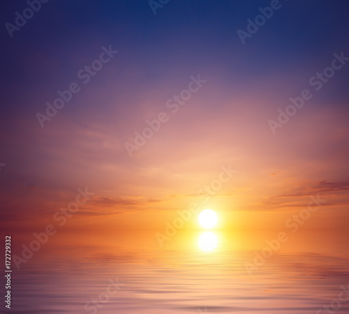 An unusual sunset against a blue-violet sky over the sea. © Sviatoslav Khomiakov