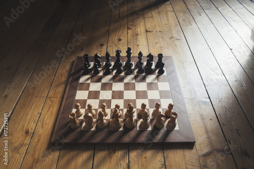 Wooden chess board on parquet