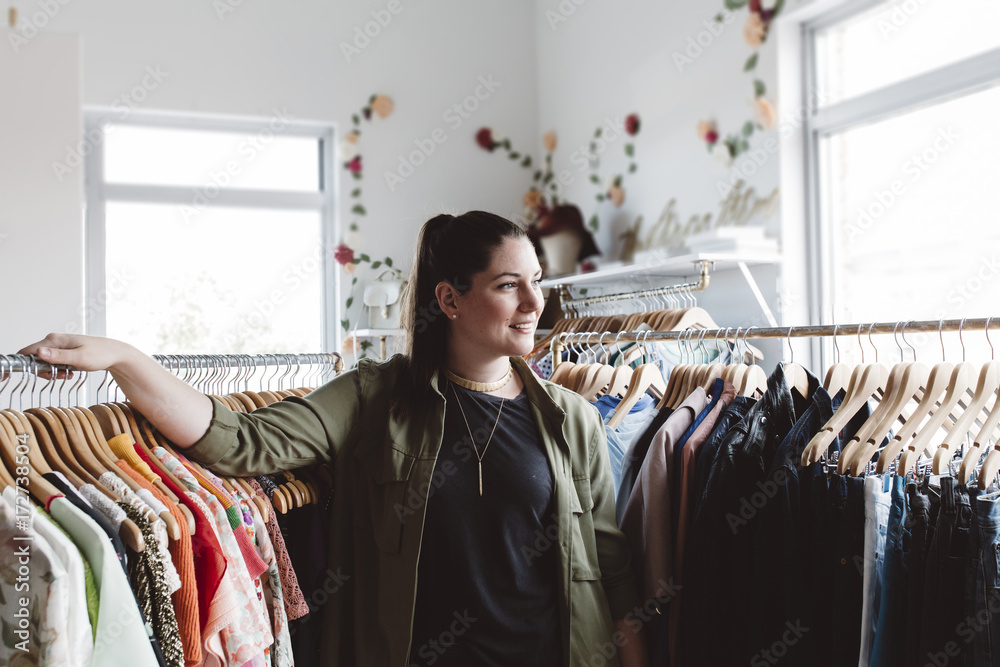 Small business owner in her clothing store Small business owner in her clothing store