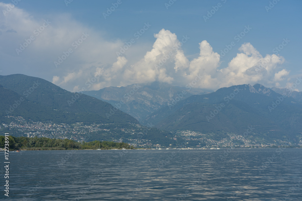 lago maggiore lake scenery with mountain water and cloudy sky