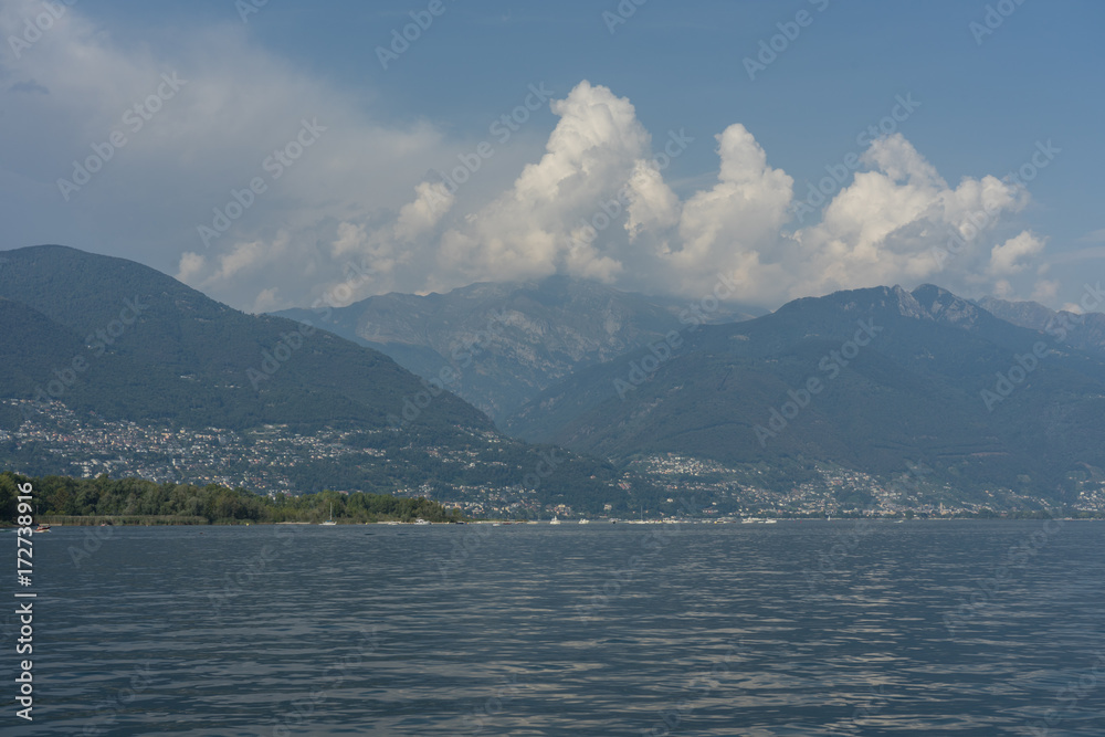 lago maggiore lake scenery with mountain water and cloudy sky lago maggiore lake scenery with mountain water and cloudy sky