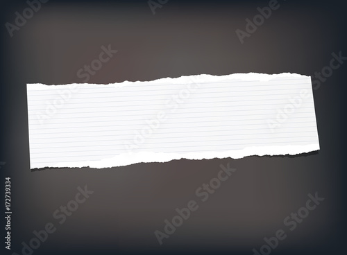 White note, notebook, copybook paper strip stuck on black background.