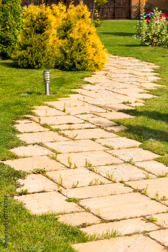 a footpath made of natural stone in a landscape park