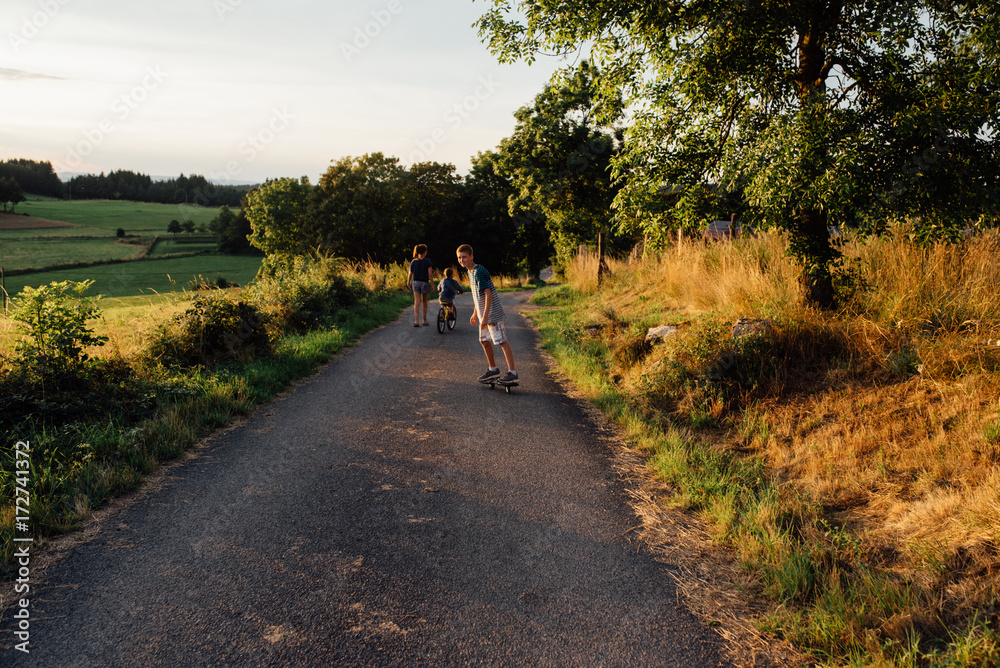 evening walk with children in countryside evening walk with children in countryside