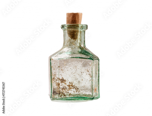 Vintage small glass bottle with paper cork isolated on white
