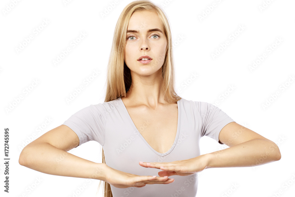 Young beautiful blonde woman in white fitness clothing