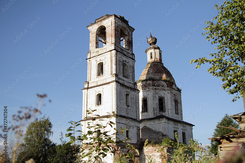destroyed stone orthodox church and  bell tower in  north of Russia Vologda region