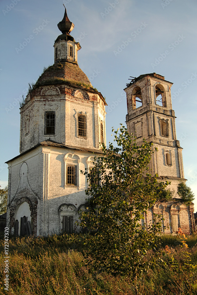 thrown destroyed stone orthodox church and  bell tower in  north of Russia Vologda region