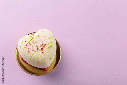 фотографія Heart shape mini mousse pastry dessert covered with white chocolate velour