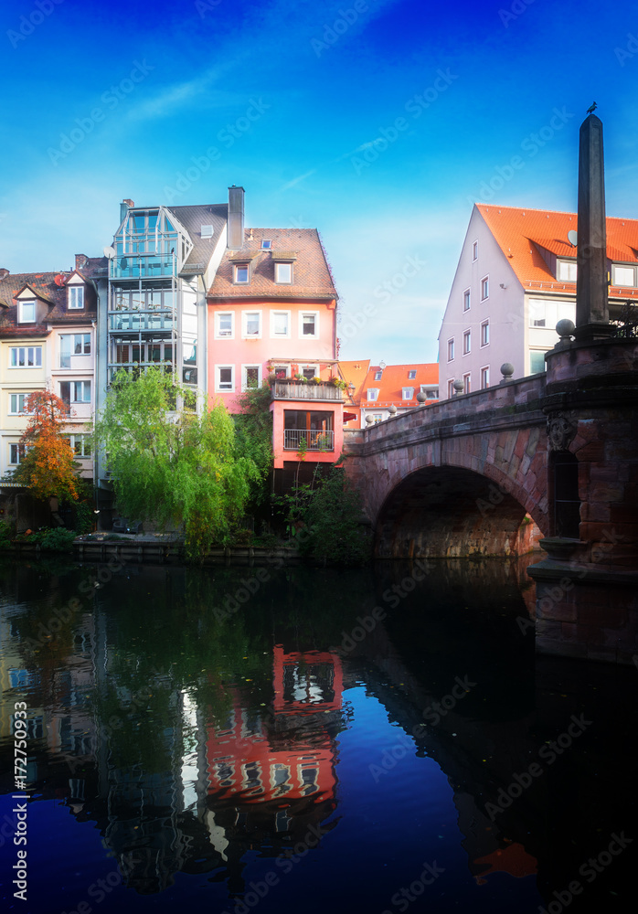 Obraz premium View of Karlsbrucke and Old town of Nuremberg over Pegnitz river, Germany, retro toned