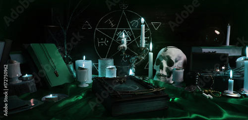 Lerretsbilde Witchcraft composition with burning candles, human skull, magic sphere, books, jewelry, tarot cards, chalk and pentagram symbol