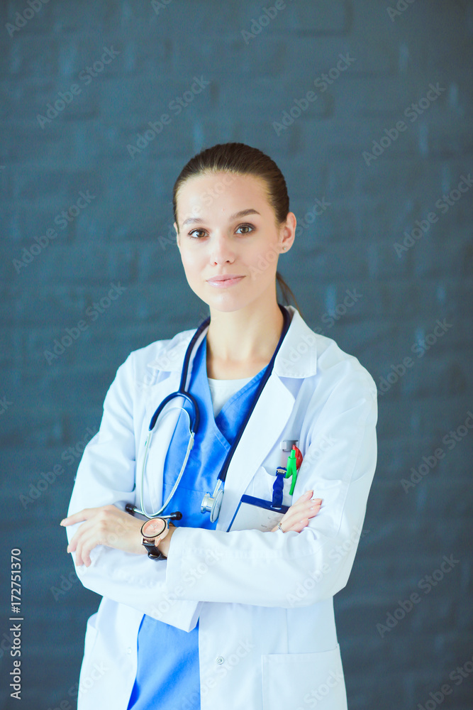 Young woman doctor sitting with your phone. Woman doctors. Young woman doctor sitting with your phone. Woman doctors.