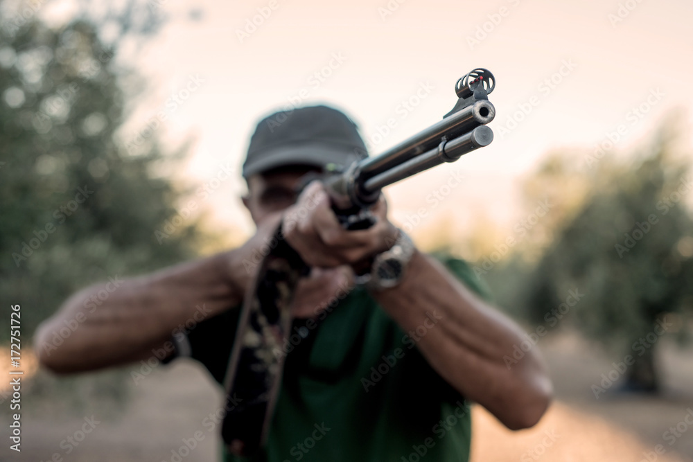Hunter with a rifle in the countryside, Spain Hunter with a rifle in the countryside, Spain