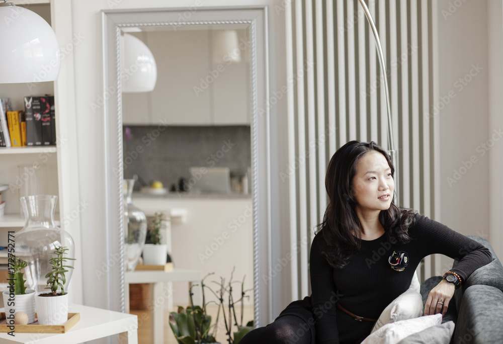 Young asian woman relaxing at home. Young asian woman relaxing at home.