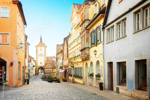 Fototapeta Naklejka Na Ścianę i Meble -  old street, Plonlein and city tower of Rothenburg ob der Tauber, Germany, retro toned