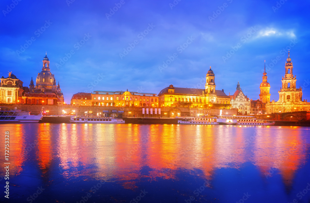 Embankment of Dresden and river Elbe at night, Germany, retro toned