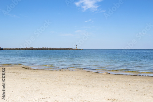 Beach blue sea and pier © Sergey