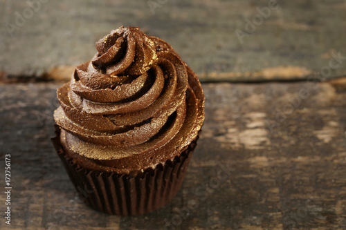 Chocolate cupcake on wooden table