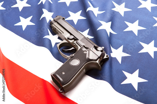 Handgun on satin US flag - studio shoot
