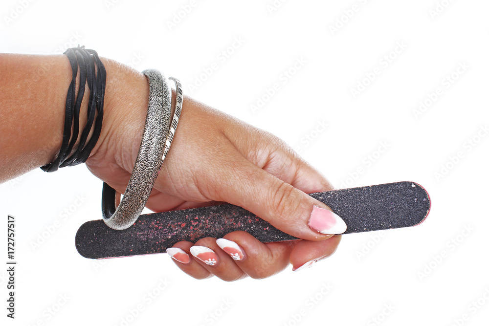 Φωτογραφία Woman hand holding  nail filer on isolated white cutout background