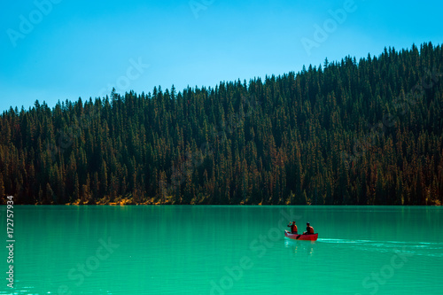 Scenic view of the Lake Louise at Banff National Park with a red canoe 