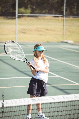 Girl playing tennis during sunny day © wavebreak3