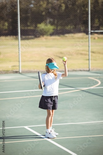 Girl playing tennis at court © wavebreak3