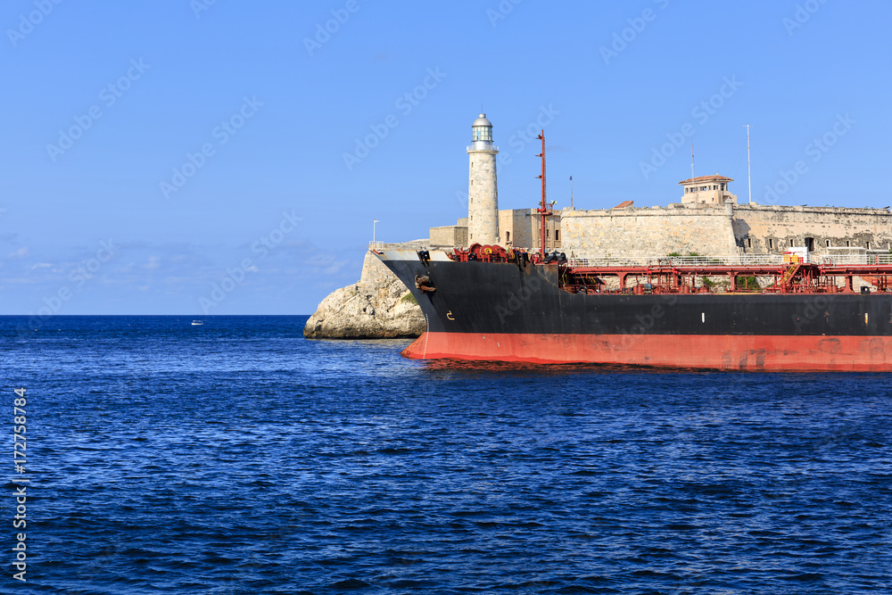 Ship in front of the Lighthouse Castillo del Morro, Havana