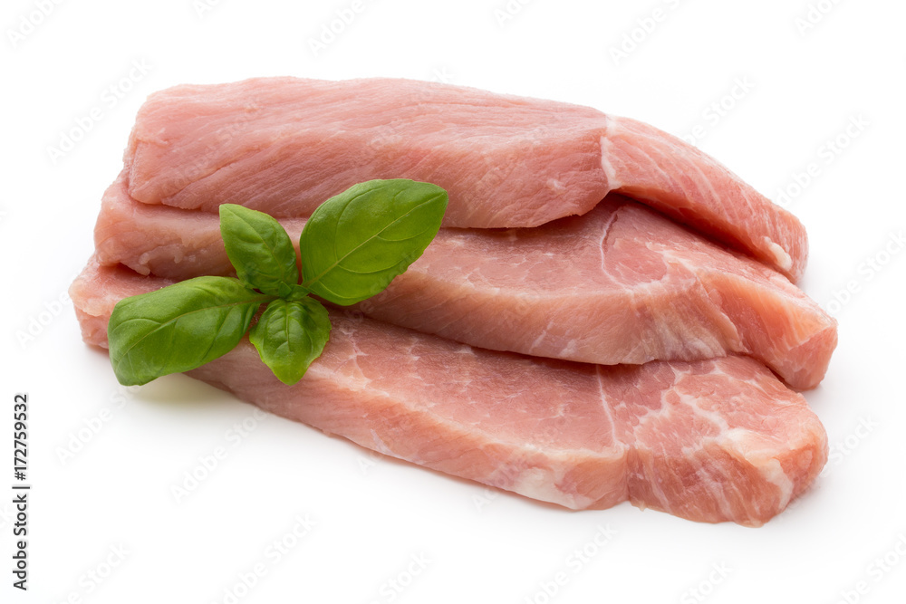 Fresh pork fillet with basil on a white background. Fresh pork fillet with basil on a white background.